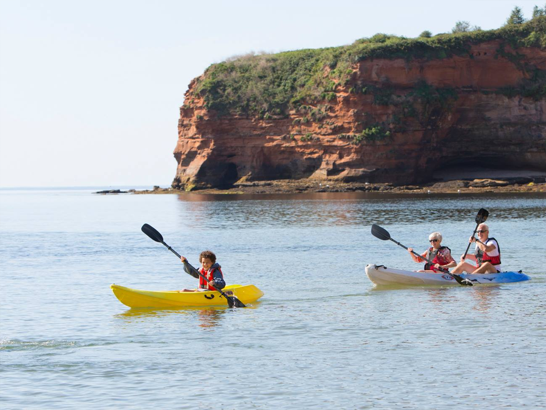 Ladram Bay in the morning with boat and paddle